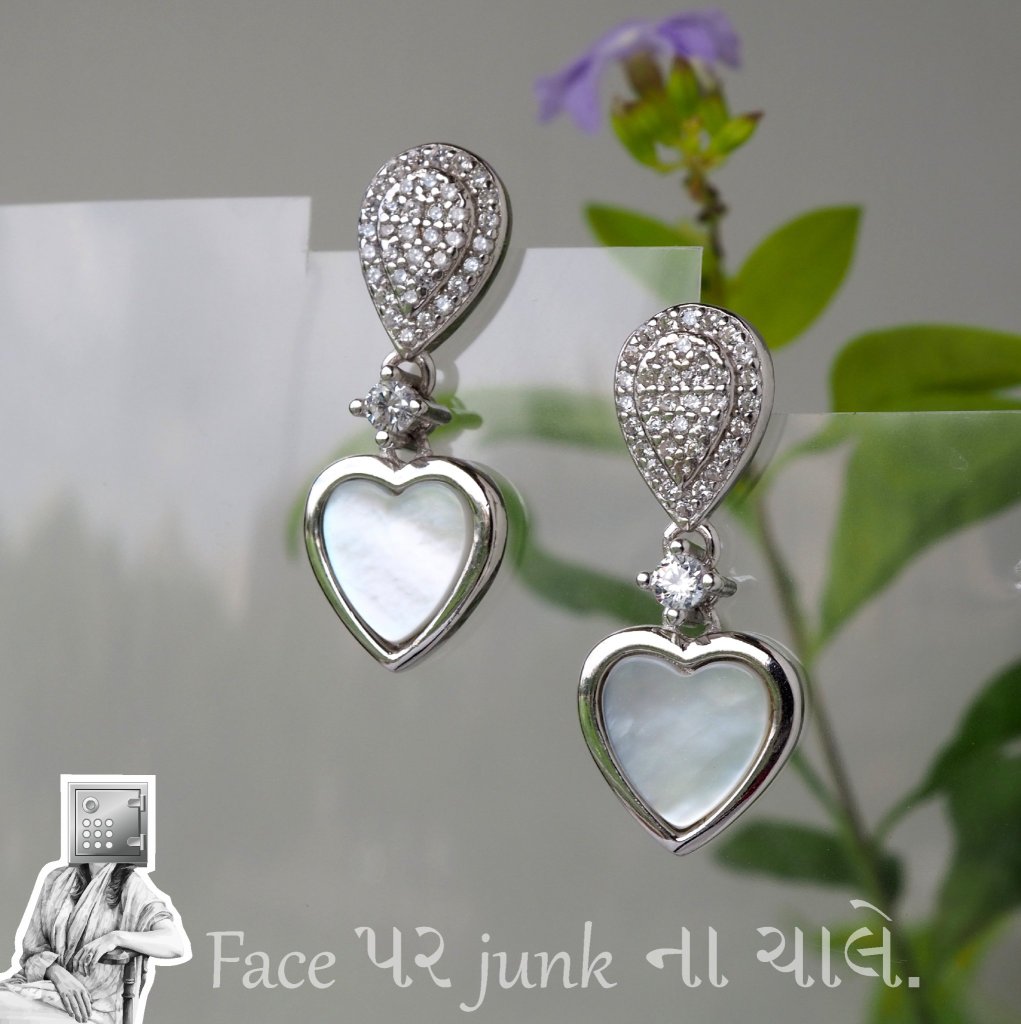 A pair of elegant earrings featuring heart-shaped pendants made of mother of pearl, adorned with sparkling crystals and set in silver.